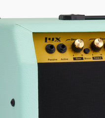 close-up of green 60-watt beginner guitar amp controls