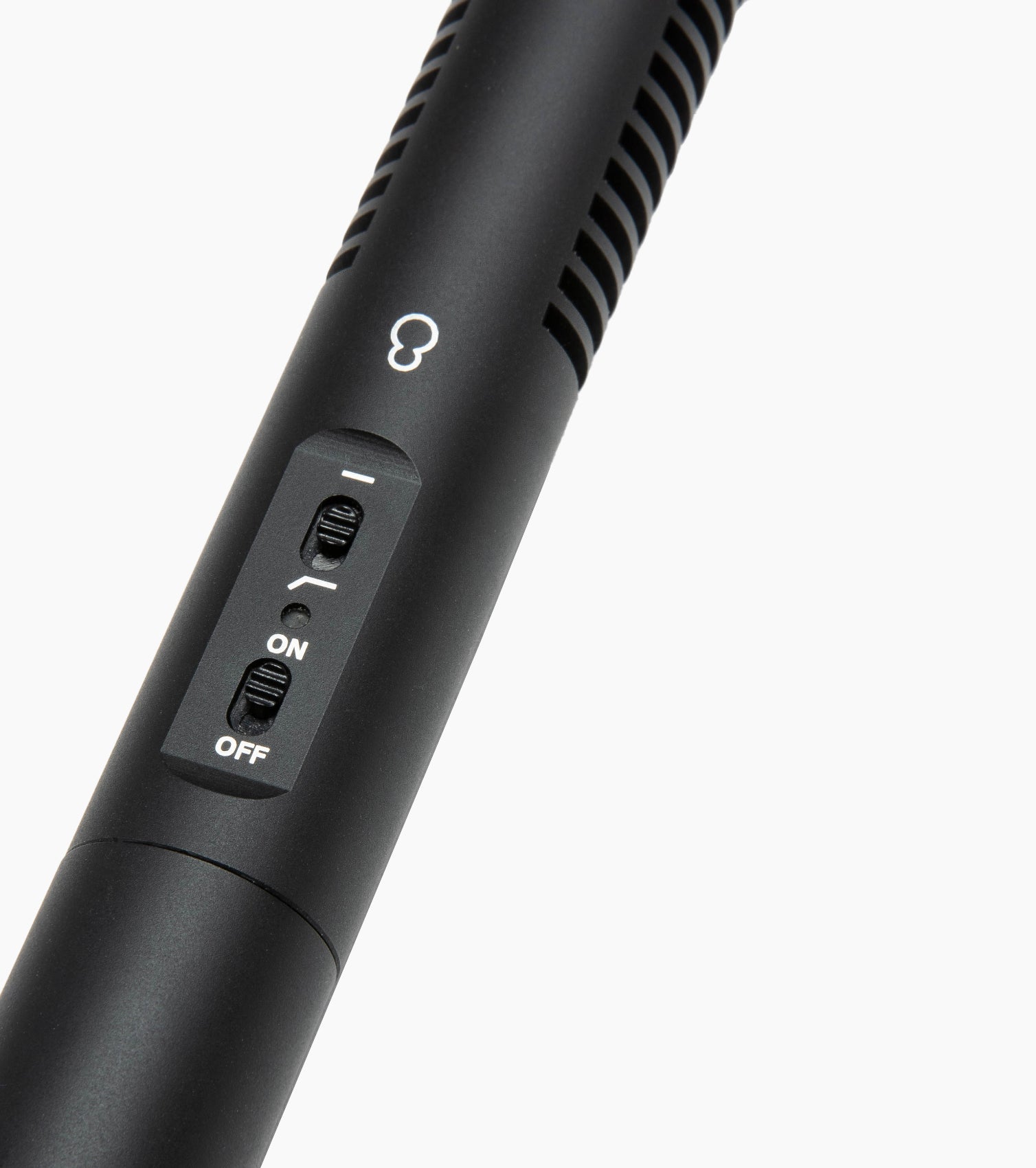 close-up of shotgun microphone on/off switch