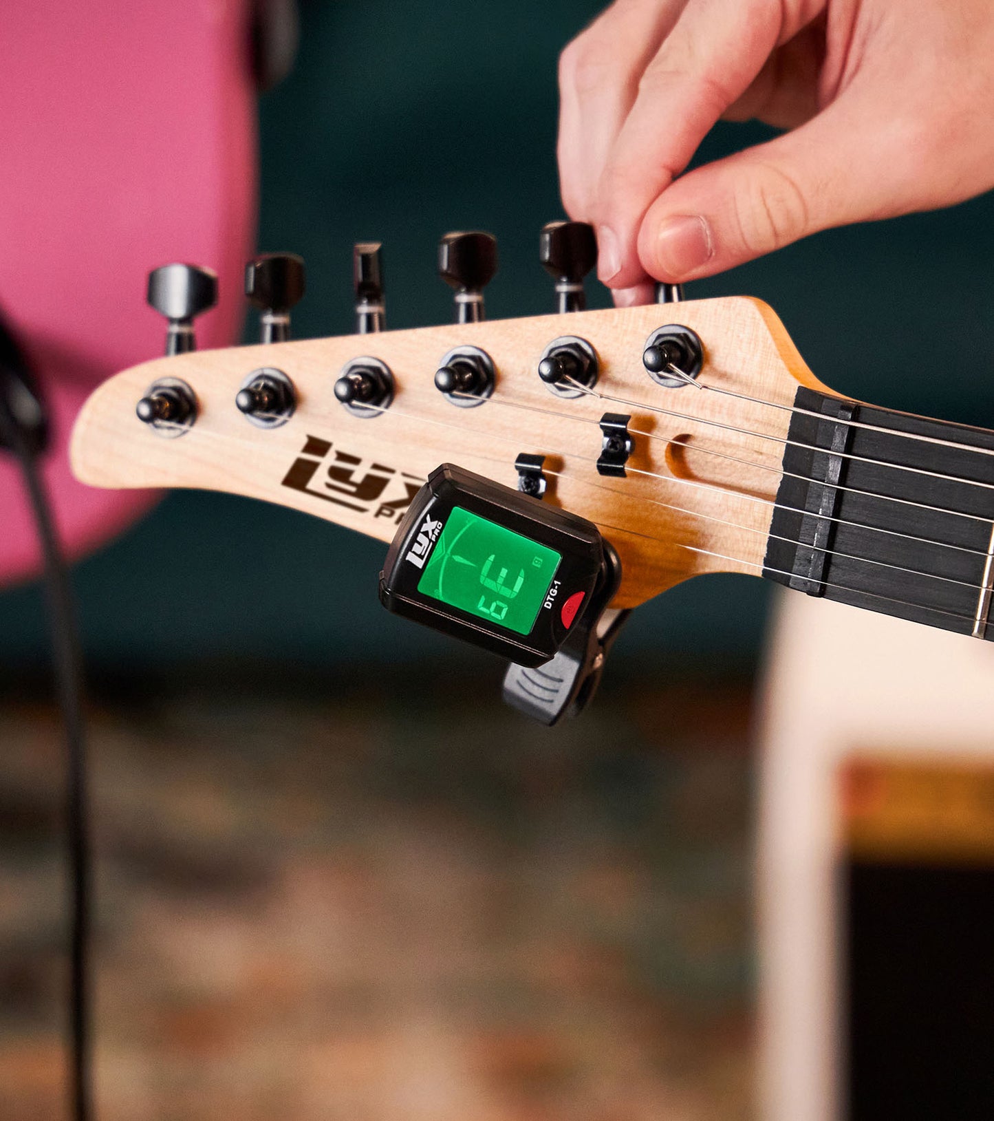 close-up of 39” Left Handed Natural beginner electric guitar with tuner