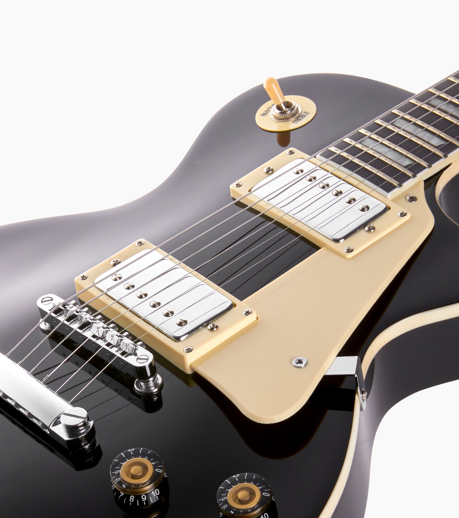 close-up of black les paul inspired electric guitar strings 