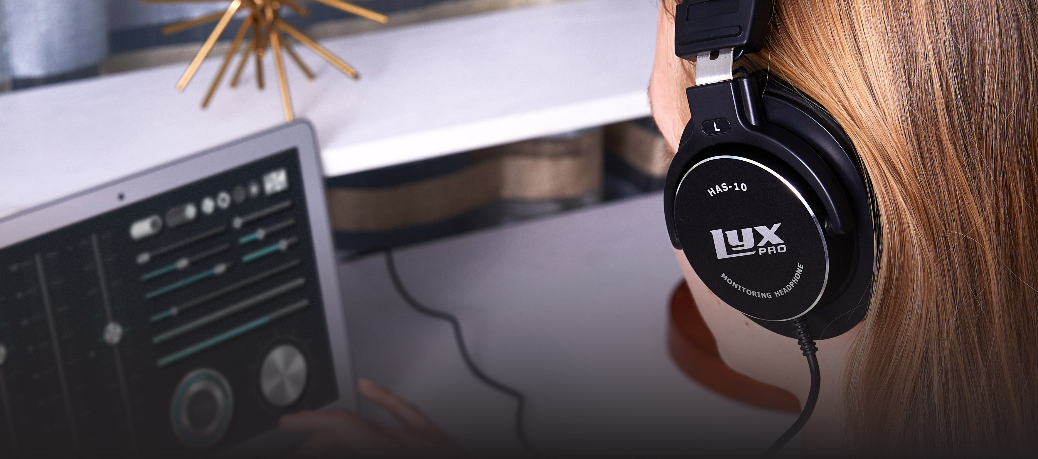  a person listening on professional studio headphones 
