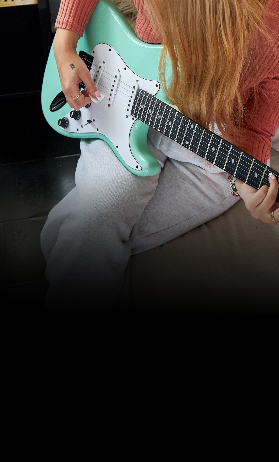 person playing a LyxPro electric guitar