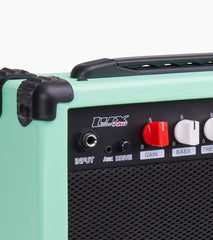 close-up of green 20 watt electric guitar amplifier controls
