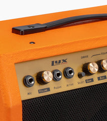 close-up of sunburst 40-watt mini guitar amplifier controls 