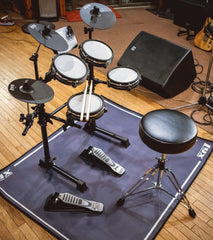 7 piece drum set with drum throne on a drum mat