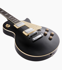 close-up of black les paul inspired electric guitar