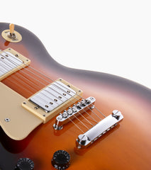 close-up of Sunburst Left Handed les paul inspired electric guitar strings