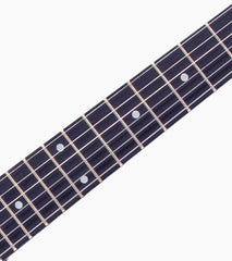 close-up of White double-cutaway beginner electric guitar fretboard