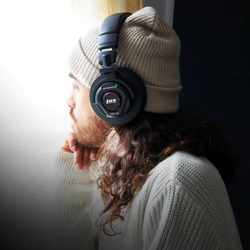 Person listening on LyxPro Studio Quality Headphones 