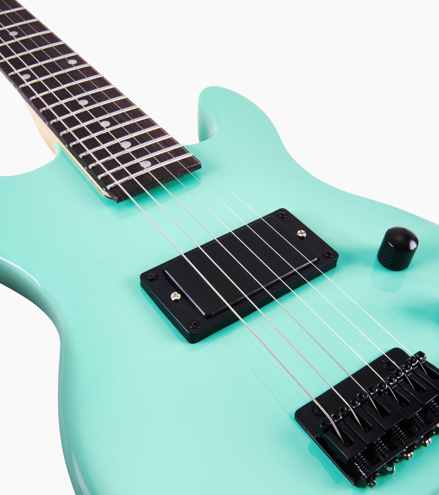 close-up of 30” green beginner electric guitar